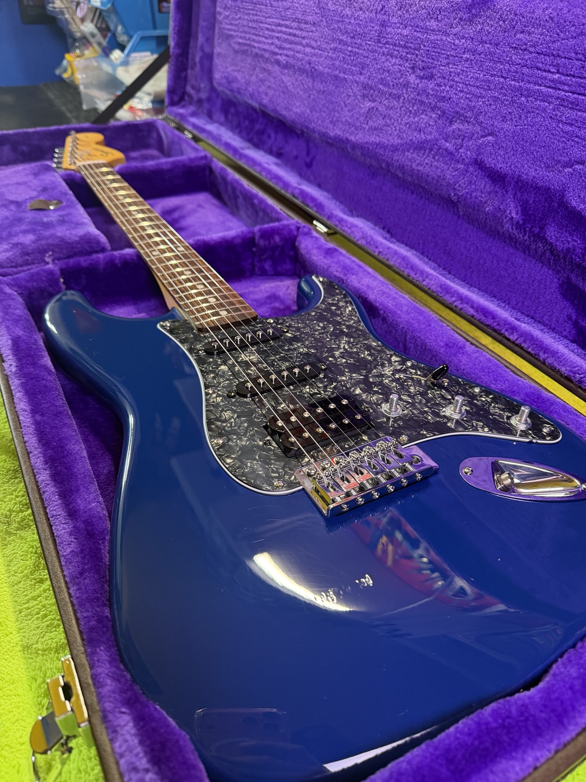 After restoration: full guitar view in purple-lined case