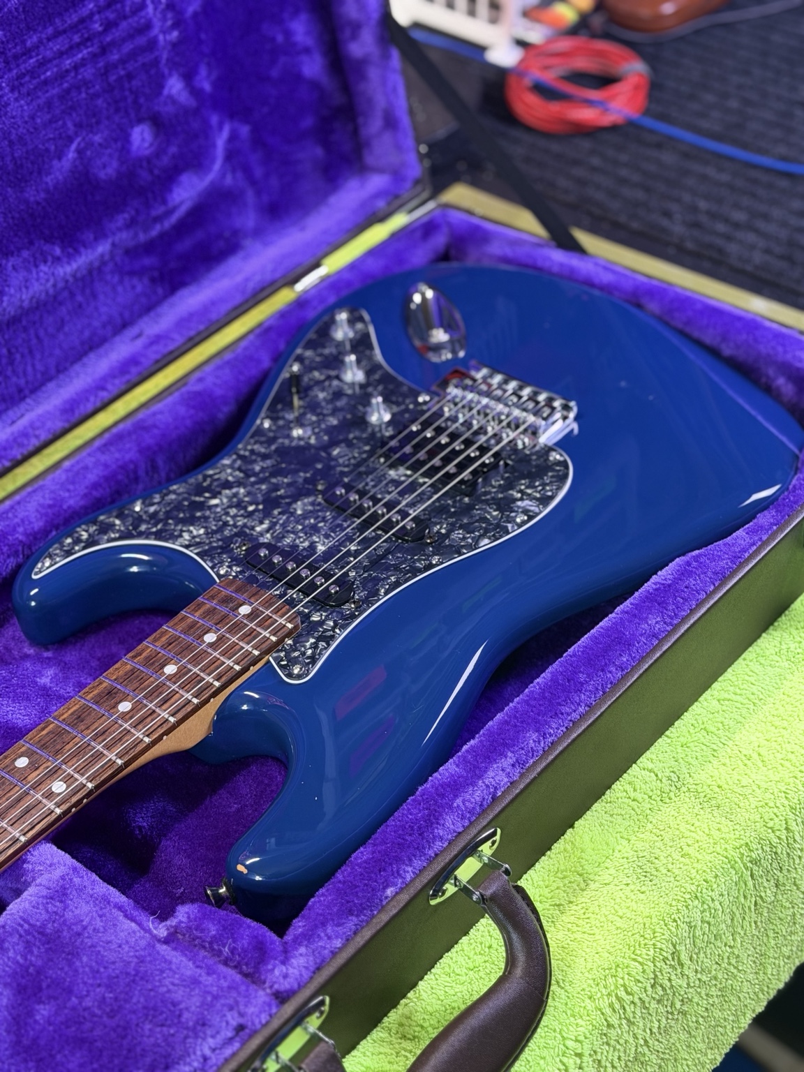 After restoration: reverse-angle view showing black pearloid pickguard