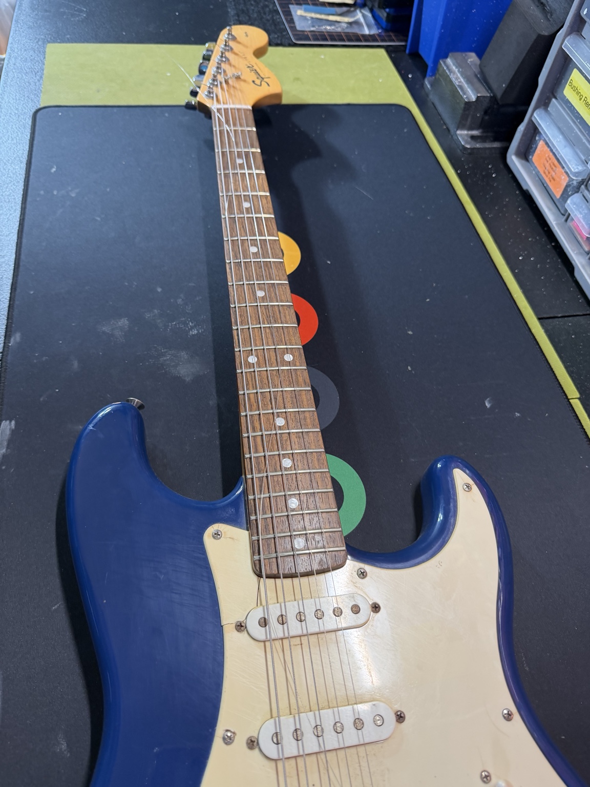 Before restoration: close-up of pickups, bridge and worn pickguard